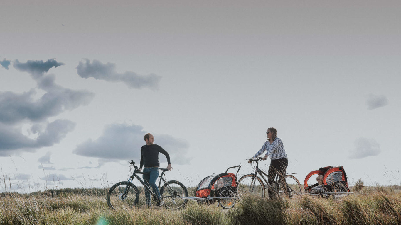 Family enjoying bike ride at Lough Boora Discovery Park, Co Offaly, Ireland's Ancient East