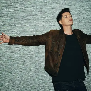 Danny O'Donoghue leaned back on a wall with his arms out