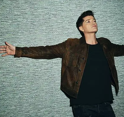 Danny O'Donoghue leaned back on a wall with his arms out